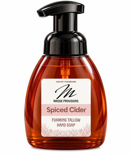 Amber Spiced Cider foaming soap by Massie Provisions in a sleek dispenser, showcasing rich amber color and elegant design.