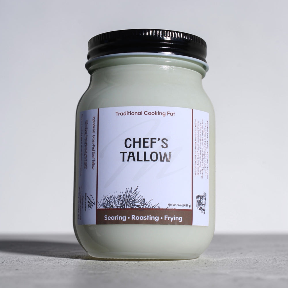 Jar of Massie Provisions Chef’s Tallow with a rustic label, showcasing creamy, rendered beef fat in a glass container.