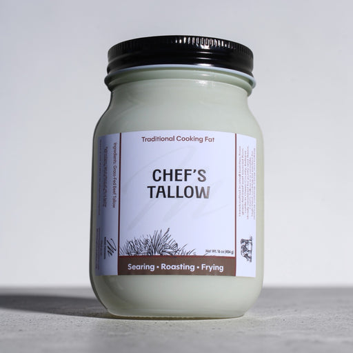 Jar of Massie Provisions Chef’s Tallow with a rustic label, showcasing creamy, rendered beef fat in a glass container.